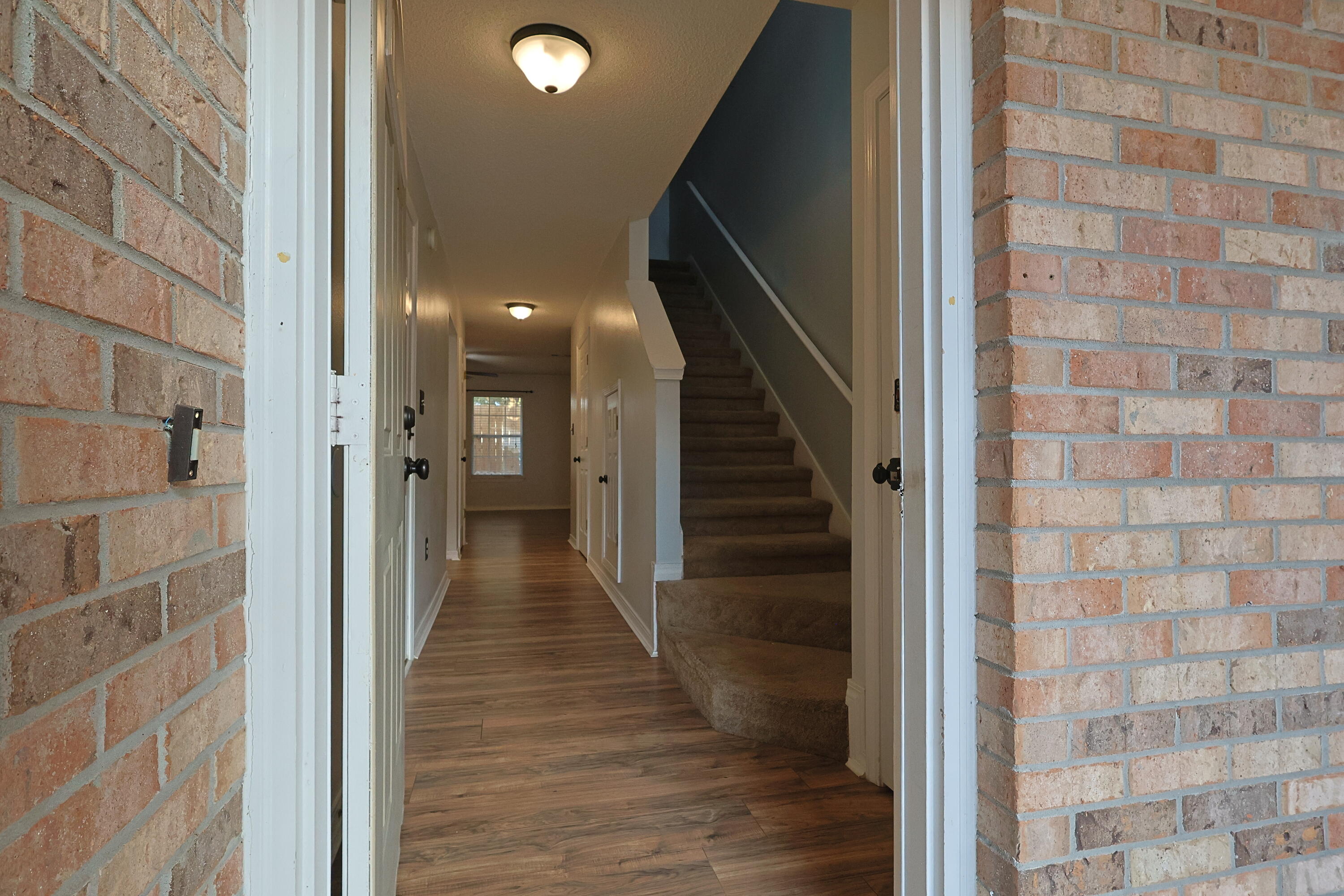 487 Keystone Road Mary Esther, FL 32569 - Photo 35 of 35 a view of a hallway with wooden floor and staircase