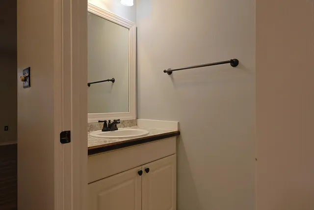 a bathroom with a sink and mirror
