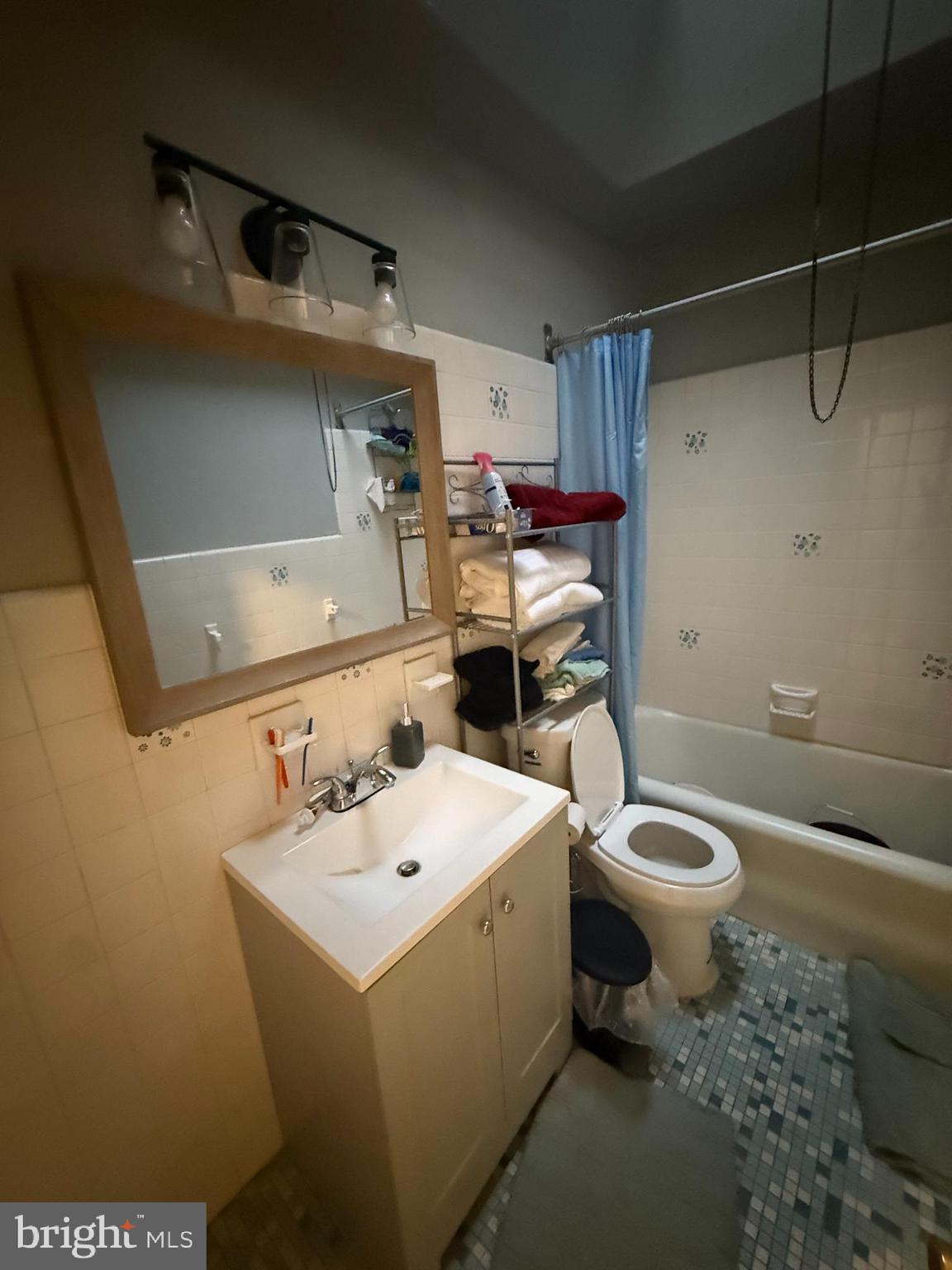 1861 South 65th Street Philadelphia, PA 19142 - Photo 11 of 31 a bathroom with a sink toilet and shower