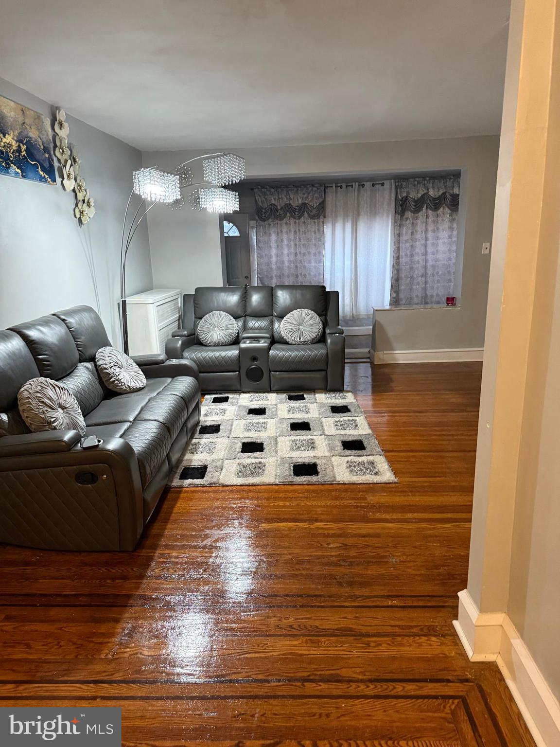1861 South 65th Street Philadelphia, PA 19142 - Photo 18 of 31 a living room with furniture and a table