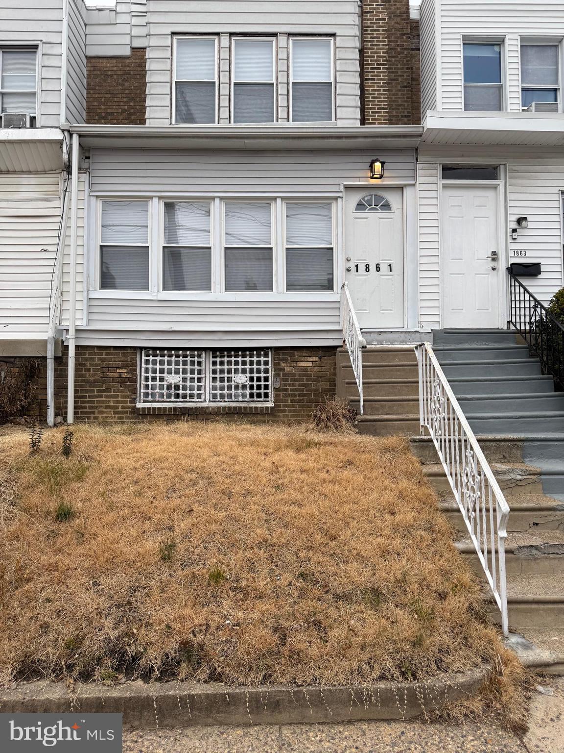1861 South 65th Street Philadelphia, PA 19142 - Photo 19 of 31 a view of a house with wooden fence