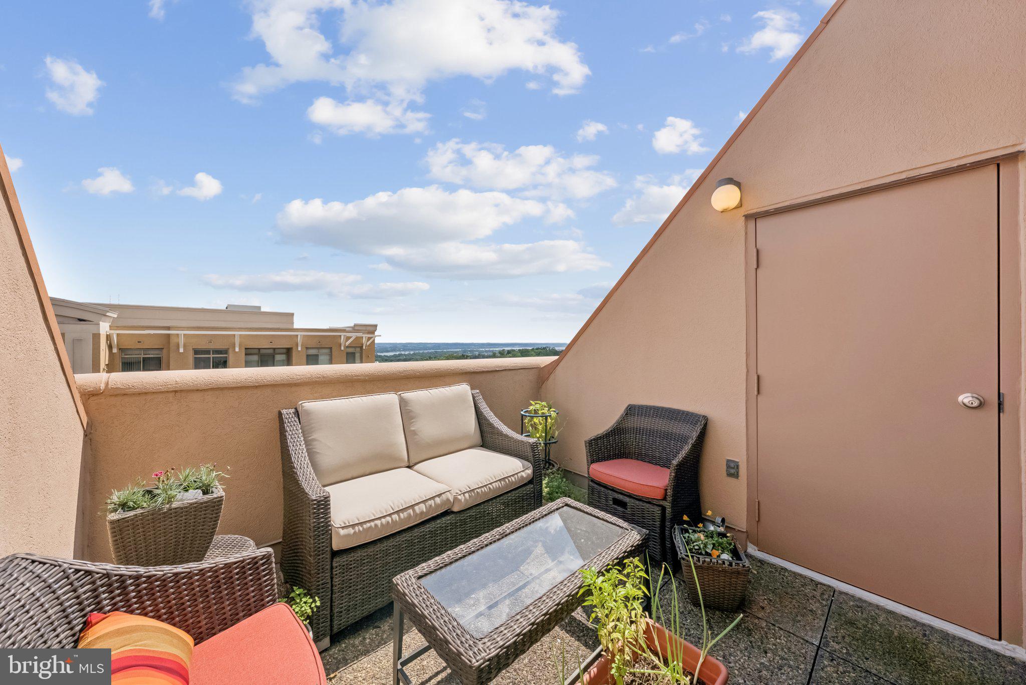 1301 North Courthouse Road, Unit 1810 Arlington, VA 22201 - Photo 19 of 29 a balcony with couch and city view