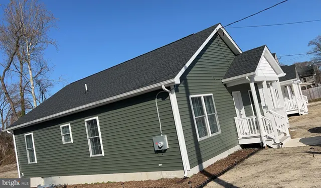 a front view of a house with stairs