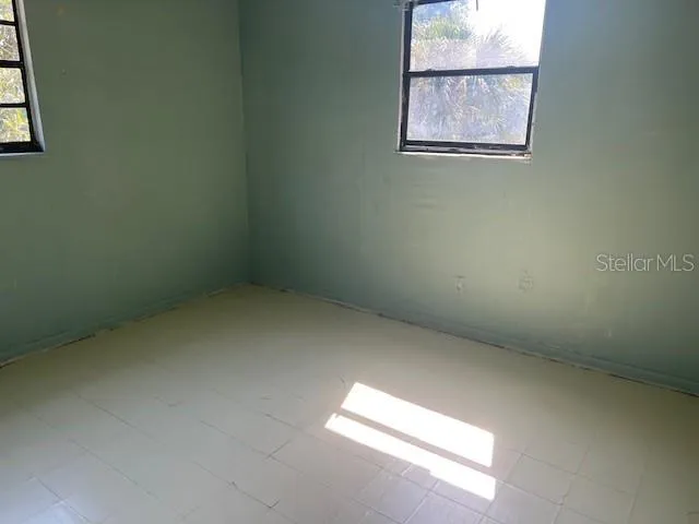 a white toilet and a bath tub sitting next to a bathroom sink