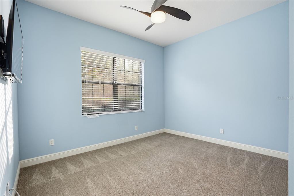 31999 Watoga Loop Wesley Chapel, FL 33543 - Photo 51 of 67 an empty room with a window and a fan