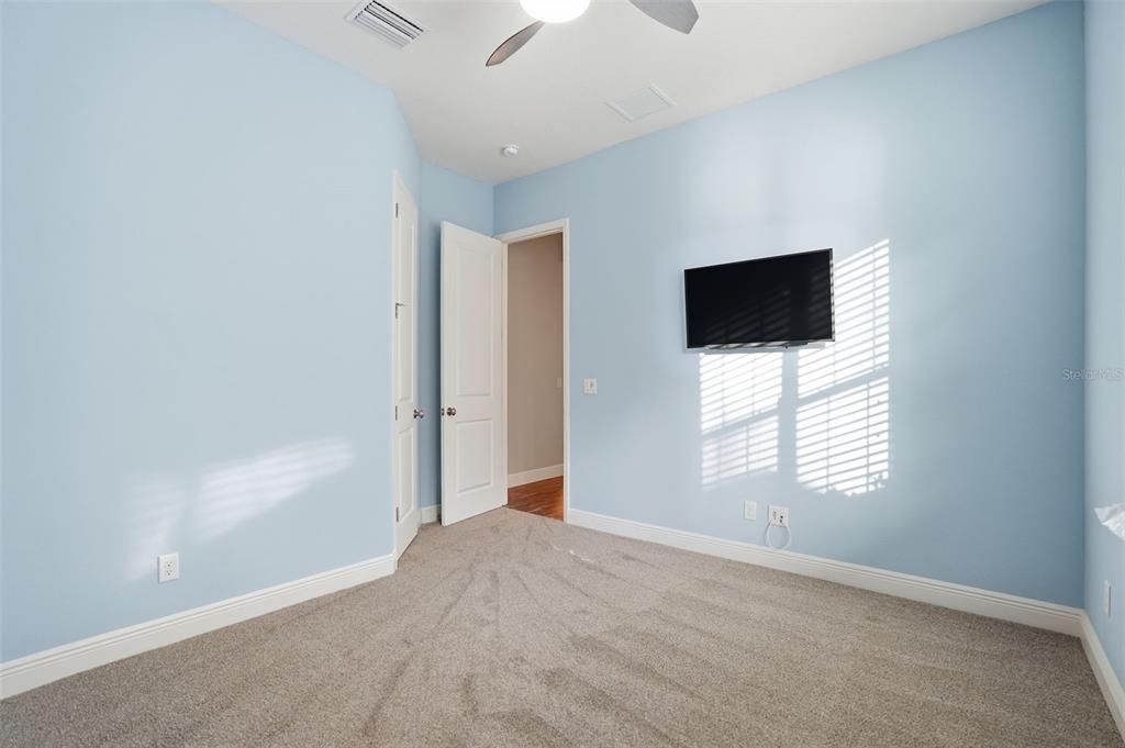 31999 Watoga Loop Wesley Chapel, FL 33543 - Photo 53 of 67 a view of a livingroom with a flat screen tv