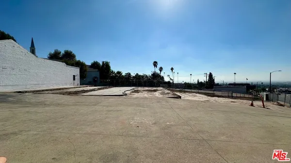 an aerial view of a house with outdoor space