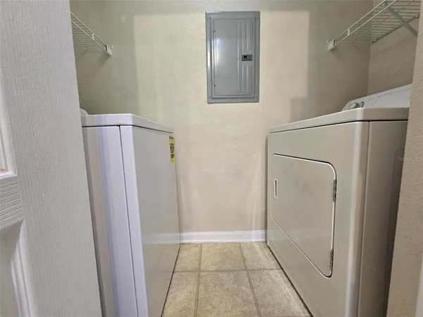 a bathroom with a glass door shower and a sink
