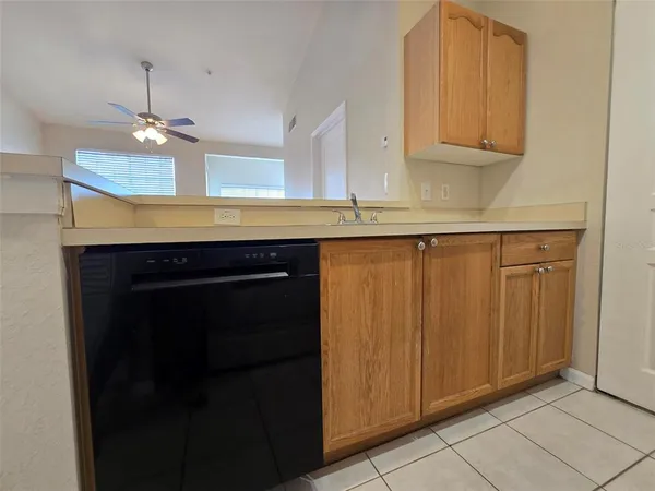 a kitchen with a cabinets and chandelier