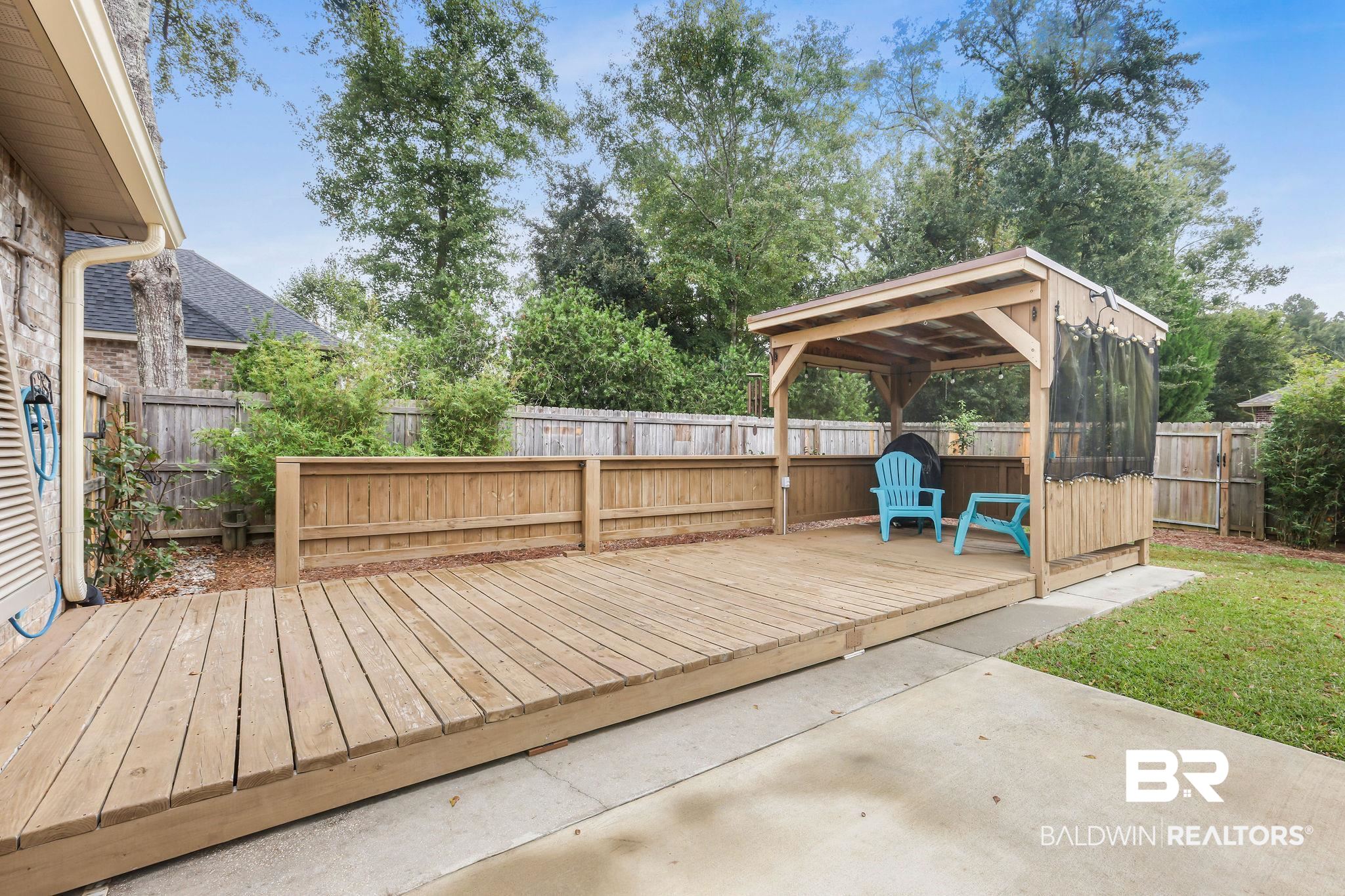 1086 Destin Avenue Foley, AL 36535 - Photo 20 of 30 Wooden deck with a gazebo and a patio area