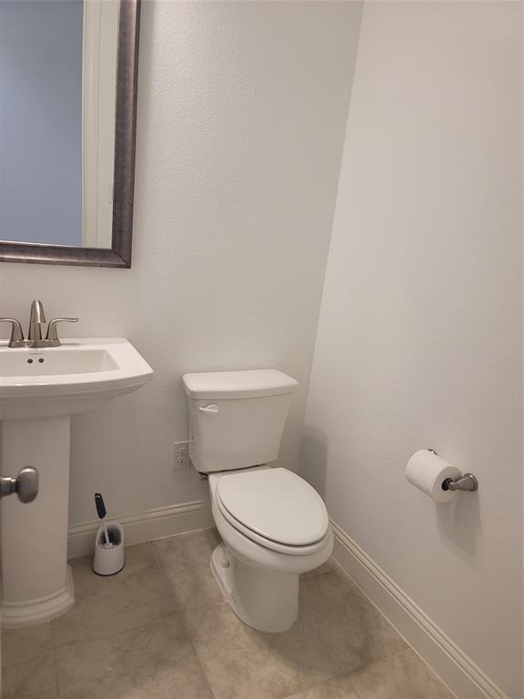 8553 Gerbera Daisy Road Frisco, TX 75035 - Photo 13 of 32 Half bathroom featuring baseboards and toilet