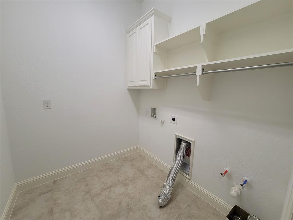 8553 Gerbera Daisy Road Frisco, TX 75035 - Photo 14 of 32 Laundry room with hookup for a gas dryer, cabinet space, hookup for a washing machine, and hookup for an electric dryer