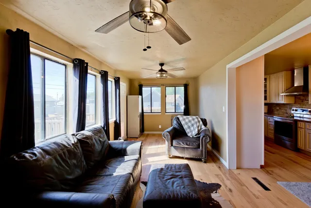 a living room with furniture or couch and a chandelier