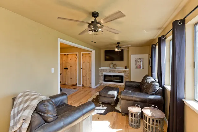 a living room with furniture and a fireplace