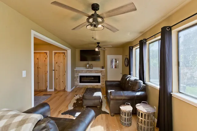 a living room with furniture and a fireplace
