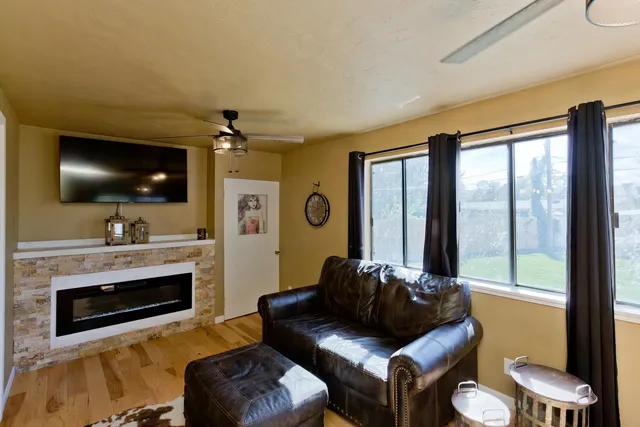 a living room with furniture and a flat screen tv