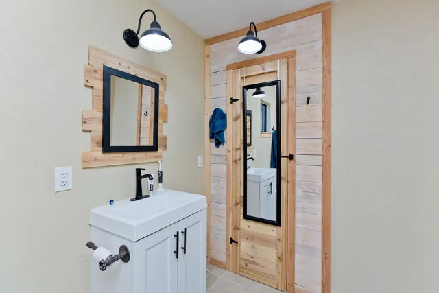a bathroom with a sink and a mirror