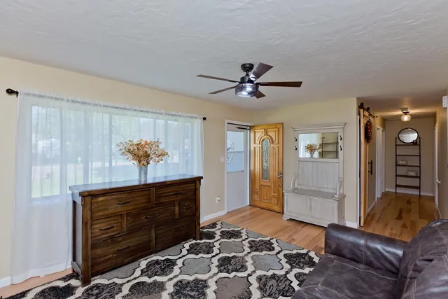 a living room with furniture and a rug