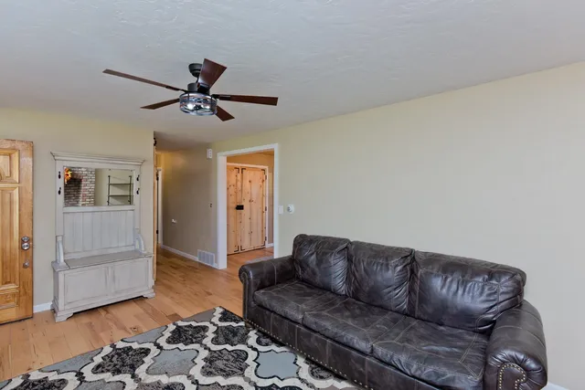 a living room with a couch and a rug
