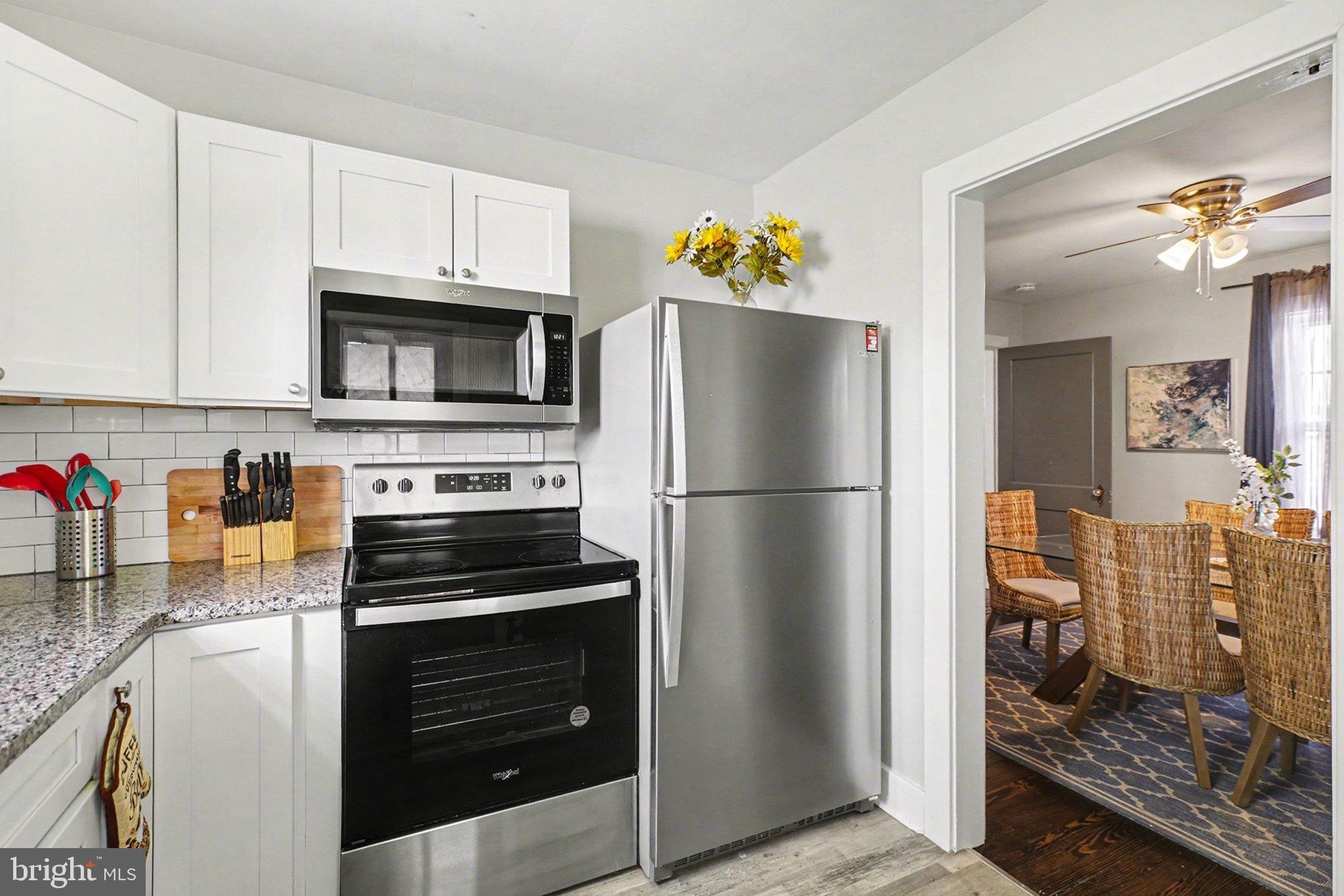 348 East Derry Road Hershey, PA 17033 - Photo 5 of 16 a kitchen with a refrigerator and a stove top oven