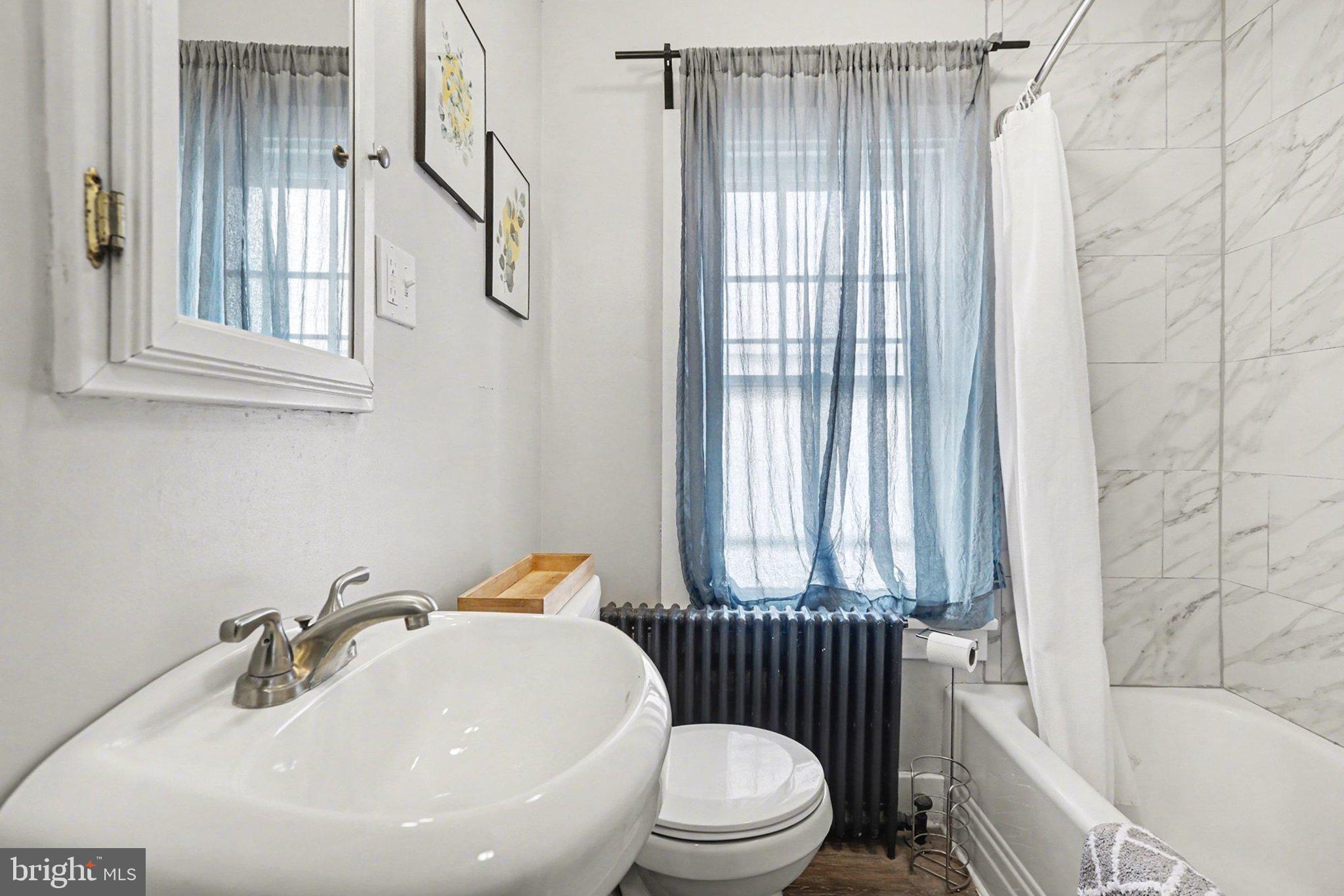 348 East Derry Road Hershey, PA 17033 - Photo 8 of 16 a bathroom with a sink toilet and shower