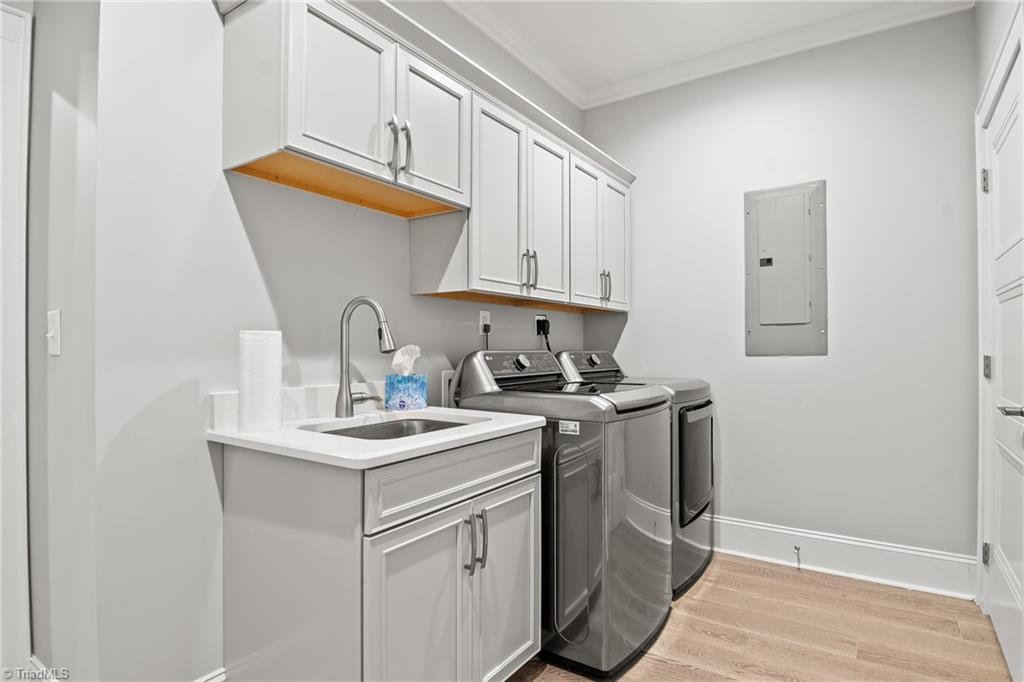 2136 Darrow Road Winston-Salem, NC 27101 - Photo 34 of 50 The laundry room is connected to the primary walk-in closet for convenience!
