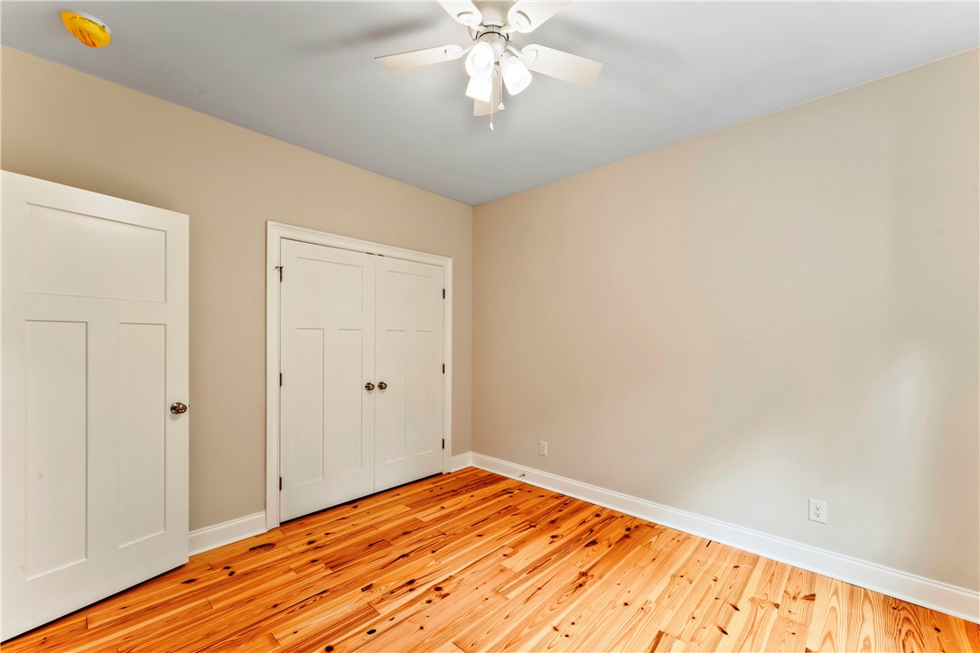 110 Gabriel Way Pickens, SC 29671 - Photo 27 of 48 Rich hardwood flooring complements a neutral palette and ample closet space in this restful bedroom.