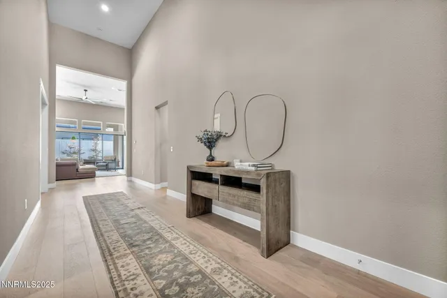 a spacious bathroom with a sink and a mirror