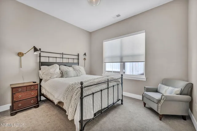 a large white bed in a white room