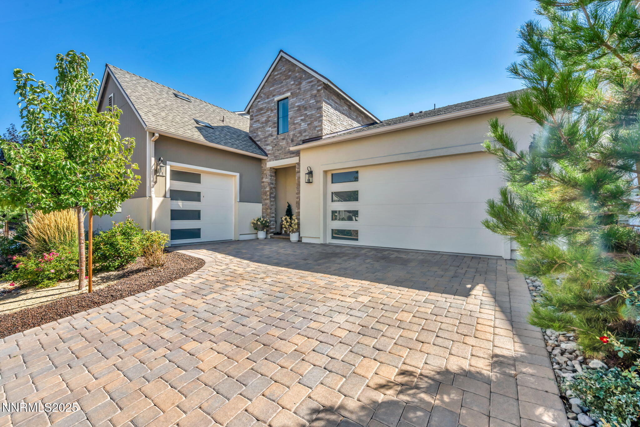 5441 Side Saddle Trail Reno, NV 89511 - Photo 2 of 25 a front view of a house with a yard and garage