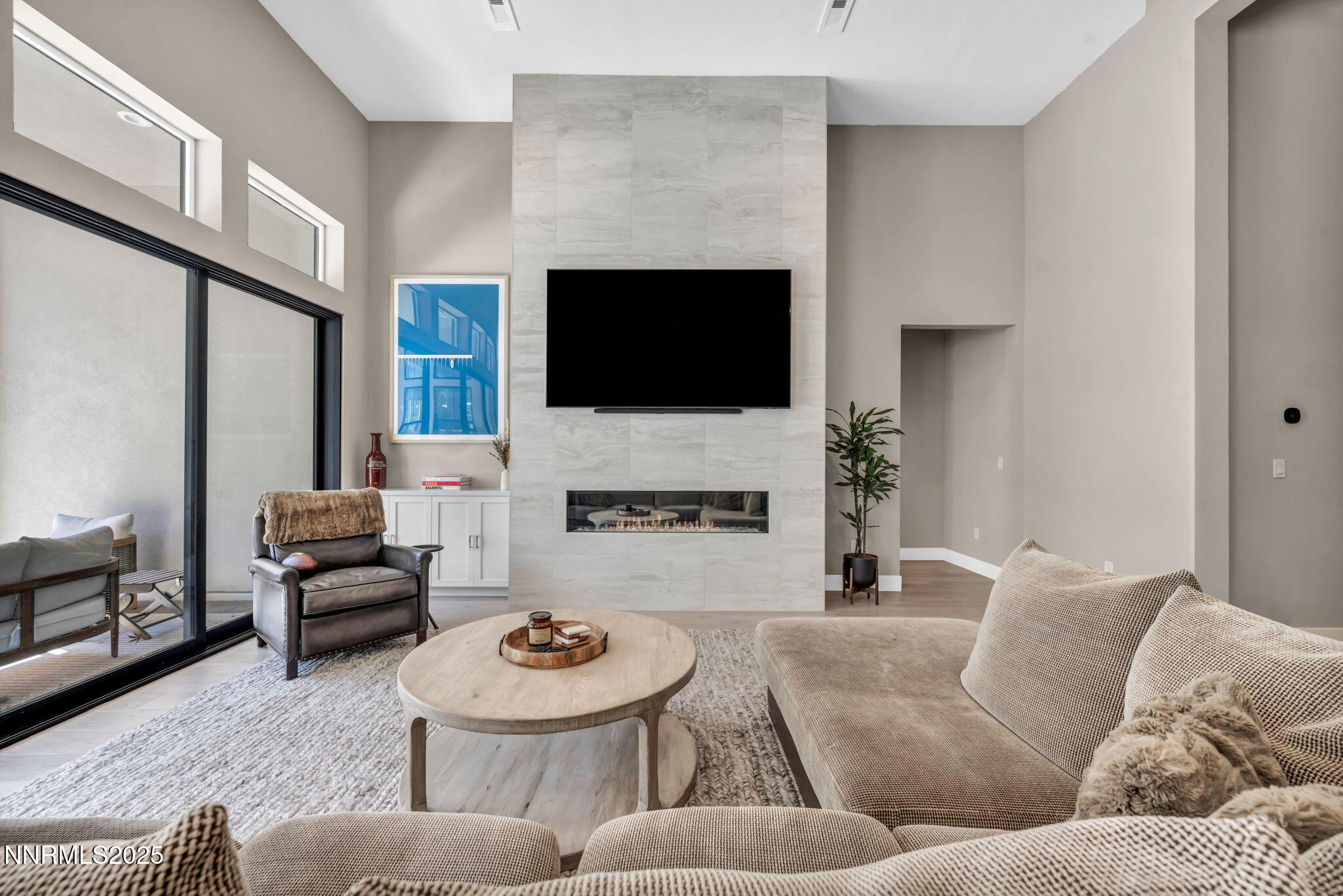 5441 Side Saddle Trail Reno, NV 89511 - Photo 3 of 25 a living room with furniture a fireplace and a flat screen tv