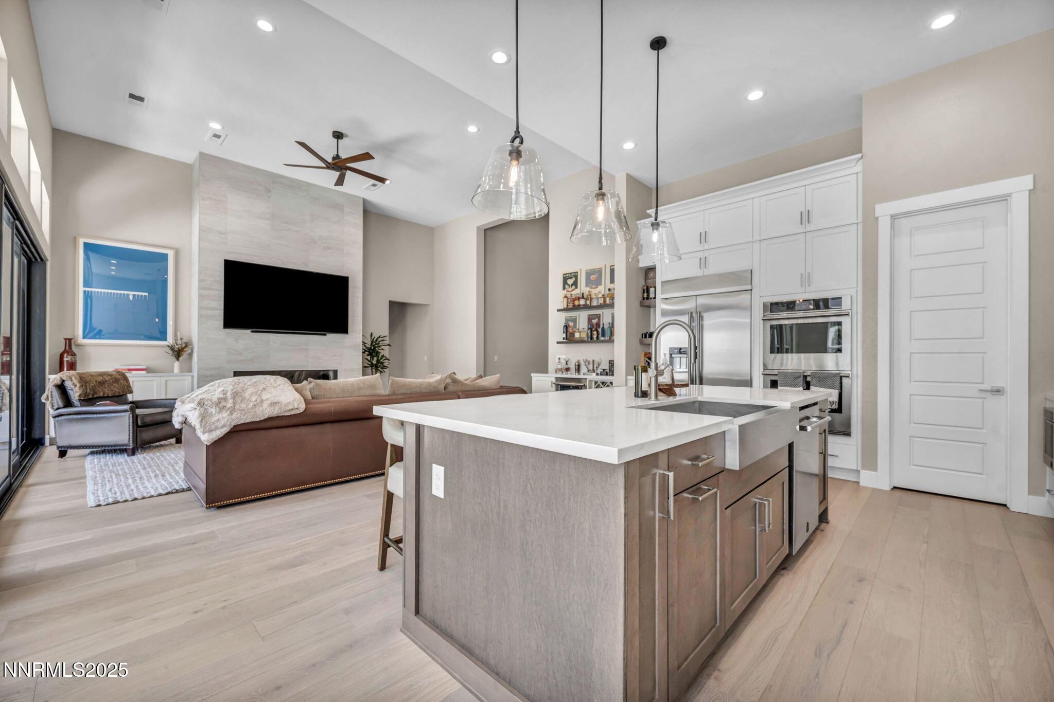 5441 Side Saddle Trail Reno, NV 89511 - Photo 6 of 25 a large kitchen with stainless steel appliances kitchen island granite countertop a sink and a stove
