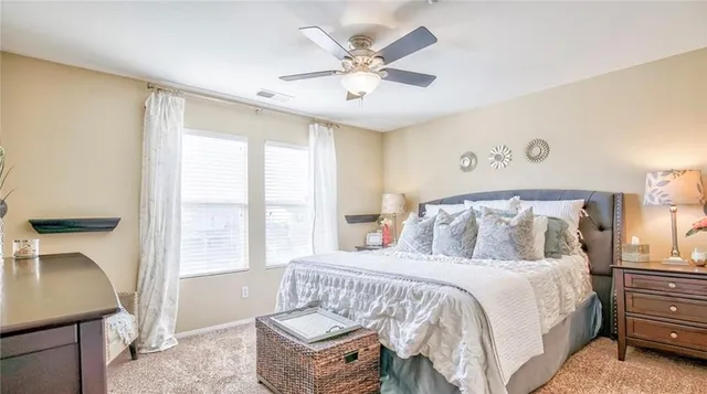 a bedroom with a bed and a table