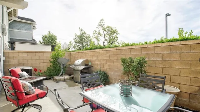 a backyard of a house with outdoor seating