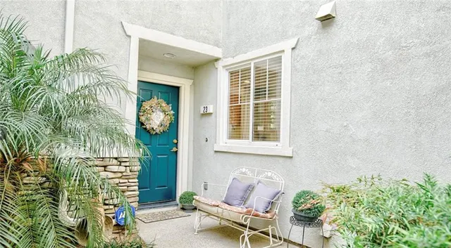 a front view of a house with outdoor seating