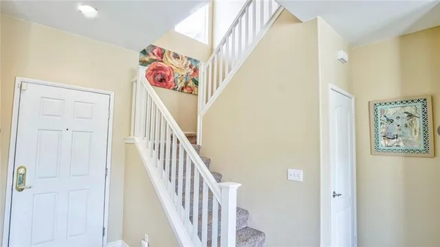 a view of an entryway with wooden floor
