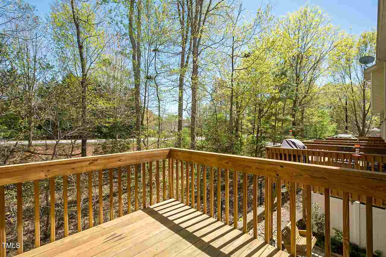 8016 Sycamore Hill Lane Raleigh, NC 27612 - Photo 18 of 19 a view of balcony with wooden floor and fence