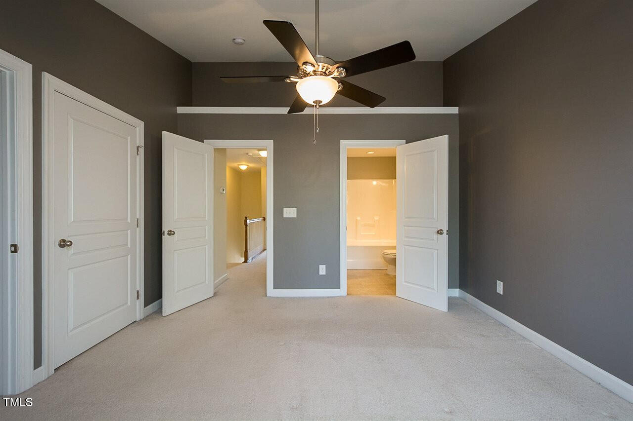 8016 Sycamore Hill Lane Raleigh, NC 27612 - Photo 4 of 19 a view of an empty room with a ceiling fan