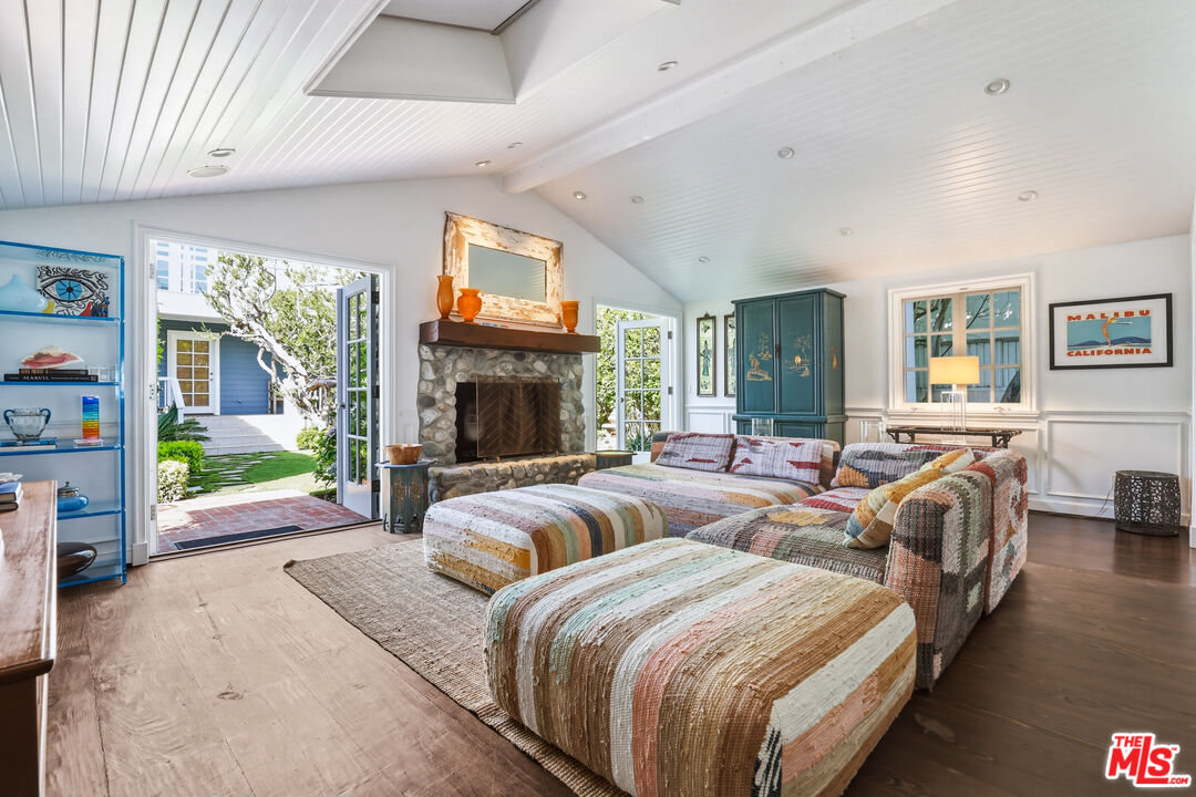 30810 Broad Beach Road Malibu, CA 90265 - Photo 19 of 55 a bed room with two beds and a fireplace