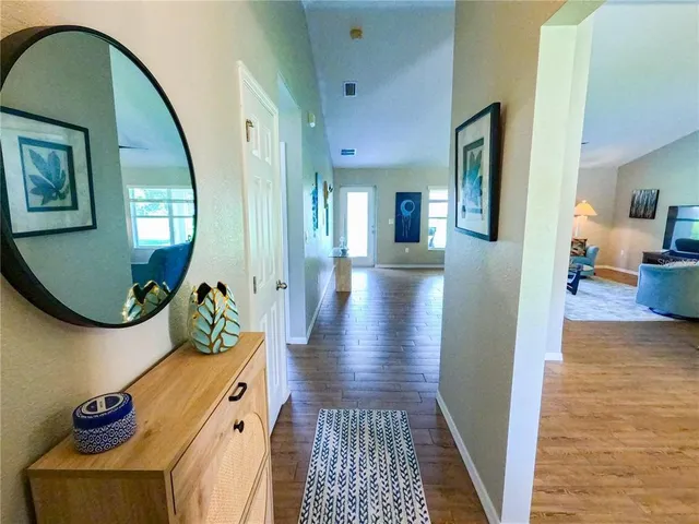a view of a livingroom with furniture and wooden floor