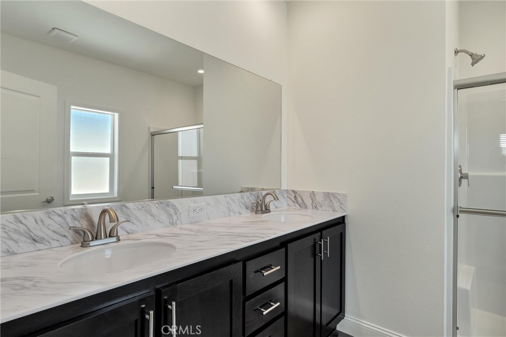 4333 Pentz Road, Unit 30 Paradise, CA 95969 - Photo 28 of 29 a bathroom with a granite countertop sink and a mirror