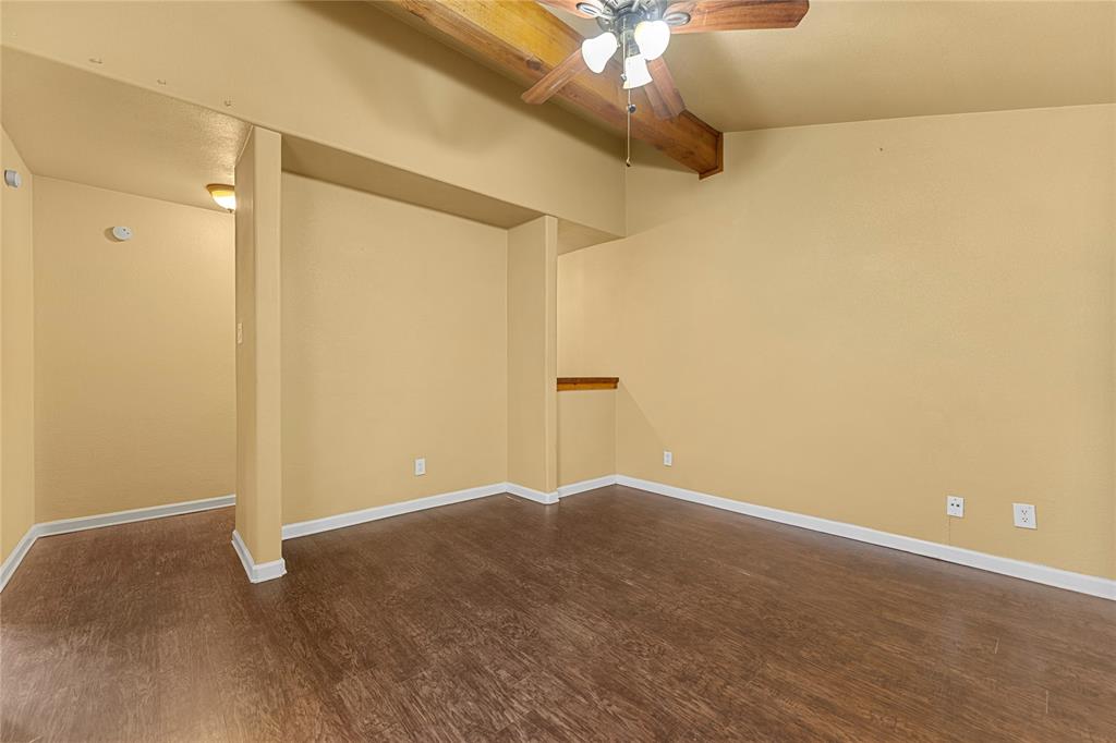 5516 Boca Raton Boulevard, Unit 310 Fort Worth, TX 76112 - Photo 15 of 19 a view of an empty room with a chandelier fan