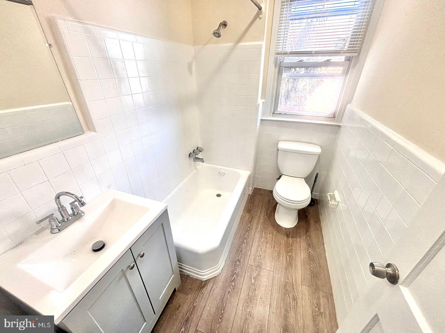 1622 Murdoch Road Philadelphia, PA 19150 - Photo 12 of 12 a bathroom with a sink a toilet and a mirror