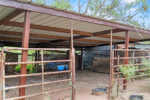 a view of a backyard of the house