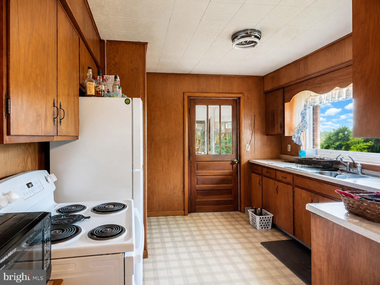 83 Bethlehem Road Oakland, MD 21550 - Photo 20 of 43 a kitchen with a refrigerator and a sink