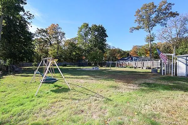 a view of playground with a slide and swing