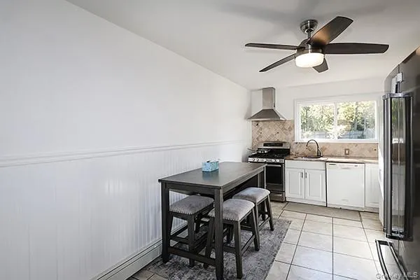 a kitchen with a sink cabinets and window