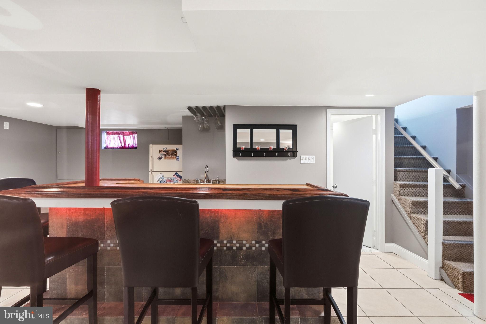905 Amosland Road Morton, PA 19070 - Photo 37 of 44 Stylish basement bar for entertaining.