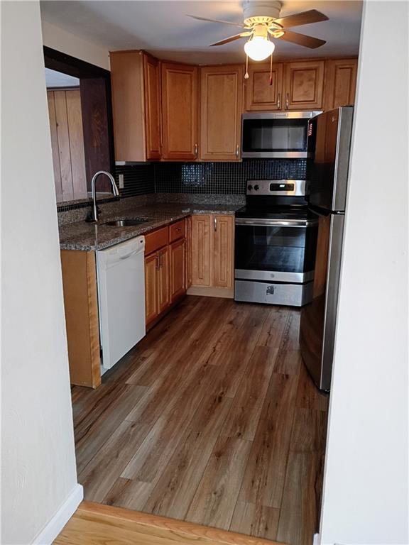 1115 Cascade Drive Homestead, PA 15120 - Photo 15 of 31 a kitchen with stainless steel appliances a stove a sink and a microwave