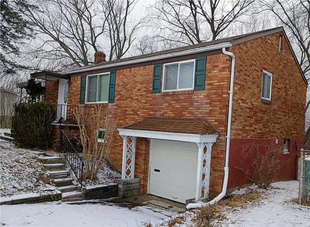 a kitchen with stainless steel appliances a refrigerator stove and sink